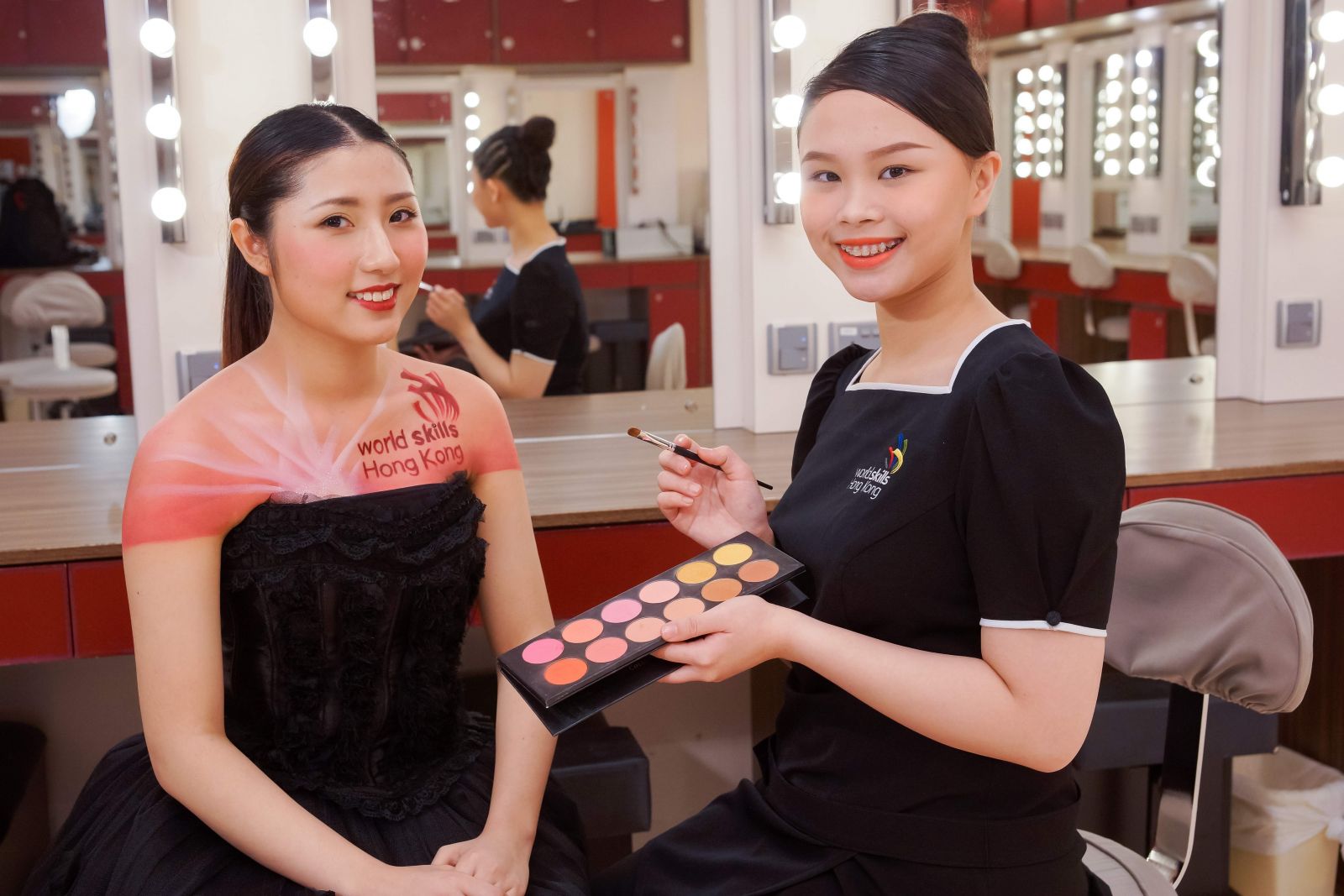 Graduate of Diploma of Vocational Education (Beauty Care) of Youth College, LAU Wai-yin (right), is honing her skills in preparation for Beauty Therapy trade at the WorldSkills Hong Kong Competition